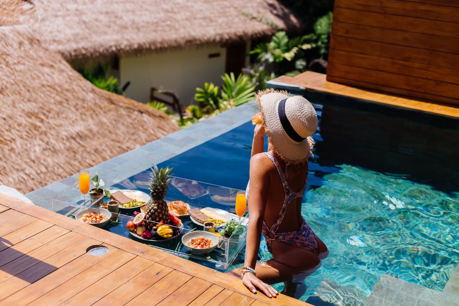 beautiful-caucasian-tanned-woman-bikini-straw-hat-with-floating-breakfast-amazing-luxury-bali-style-villa-sunny-day-by-swimming-pool-tropical-background